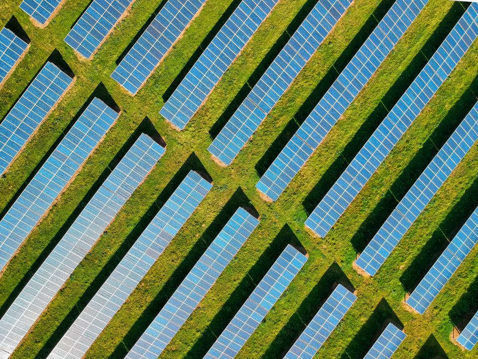 Top view of rows of PV panels in a solar farm