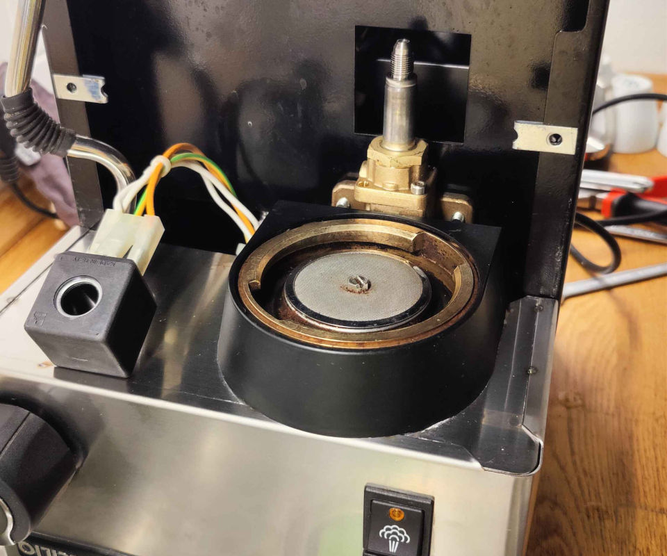 Upside-down espresso machine with coil block removed from the solenoid valve